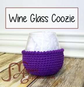 Stemless wine glass with purple crochet coozie
